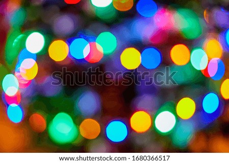 Abstract texture with light colored bokeh and black background