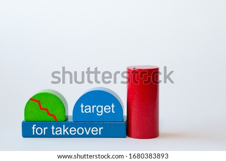toy blocks form a factory. The red curve shows rapidly below. Text: target for takeover Royalty-Free Stock Photo #1680383893