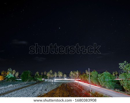 Starry night sky in countryside 