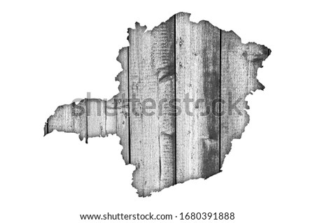 Detailed and colorful image of map of Minas Gerais on weathered wood