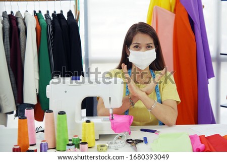 Happy Senior designer and confidence wearing a mask Prevention of viruses in her studio workshop