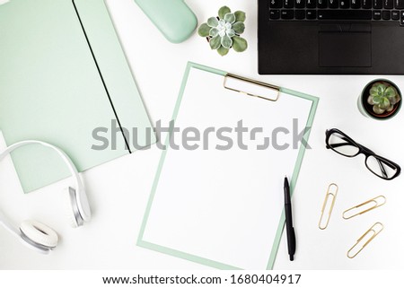Top view of office desk. Table with laptop and office supplies. Flat lay home office workspace, remote work, distant learning, video conference, calls concept 