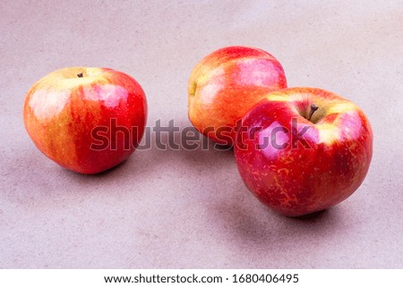 Red ripe apples on the table