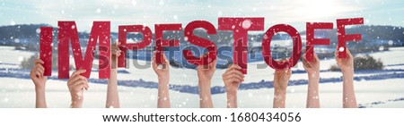 People Hands Holding Word Impfstoff Means Vaccine, Snowy Winter Background
