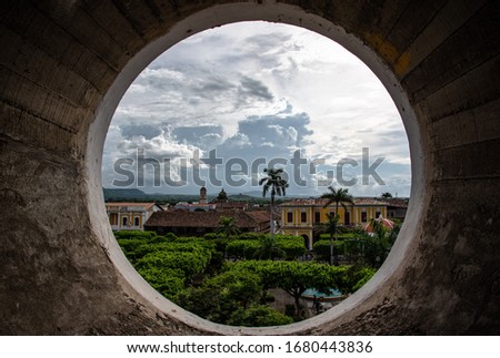 Granada Nicaragua plaza main square with view on central Park of granada from church steeple round Window historical cathedral beautiful Old town Central America culture Royalty-Free Stock Photo #1680443836