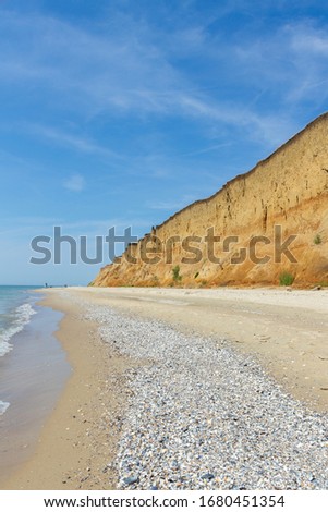 Vertical photo with the sea and clay high shore in Odessa region, Ukraine

