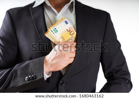 Hands with euros banknote on business background.