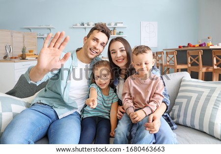 Young family having video call at home