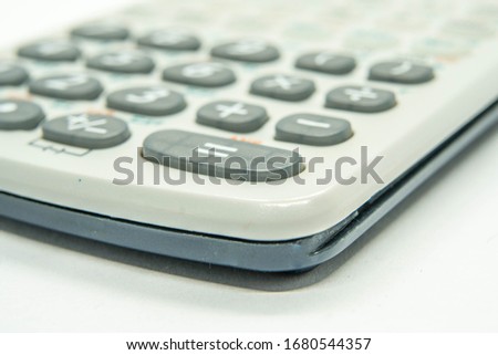 Macro shot of key equal on a gray calculator white background