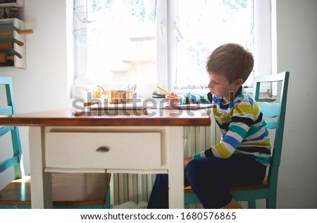 Boy doing homework, learning at home