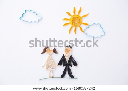 The romantic bridal couple. Hand made of paper quilling technique. Love, wedding concept.