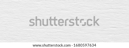 Paper texture in snowy white color for your new design. High resolution photo.
