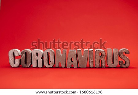 inscription from the letters 3D coronavirus covid 19 on a red background in isolation pandemic virus