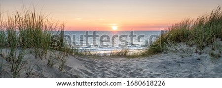 Beautiful sunset on the dune beach, North Sea, Germany Royalty-Free Stock Photo #1680618226