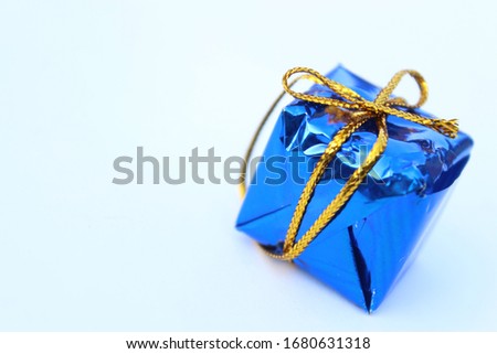 Christmas Gift in blue wrap