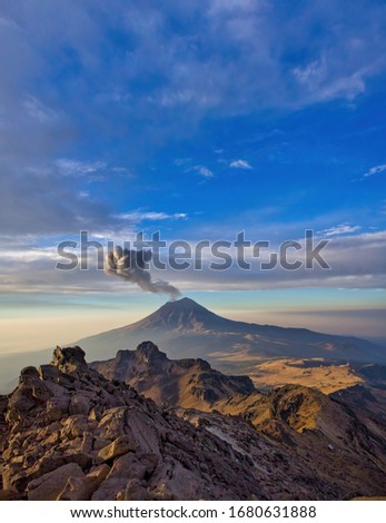 Climbing the Iztaccíhuatl volcano, Popocatepetl volcano in Mexico, Tourist on the peak of high rocks. Sport and active life concept