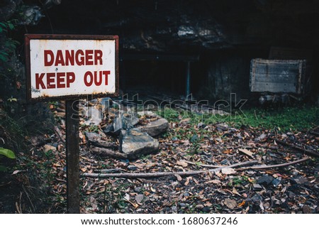 Keep out sign by mine entrance