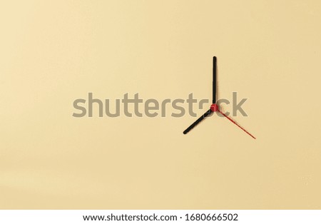 Clock hands on the background of light beige. Daylight saving time concept. Seasonal time change. Summer time concept. Copy space. 
