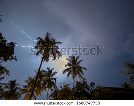 Thunder storm and lightening on a cloudy blue night sky