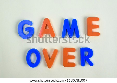 GAME OVER written in various colored letter blocks on an isolated white background