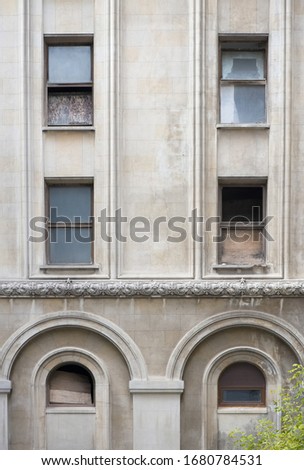 Detail of an old abandoned building with windows