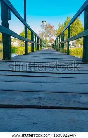 bridge that leads to a small artificial island in the interior of the city of saens peña - chaco - argentina