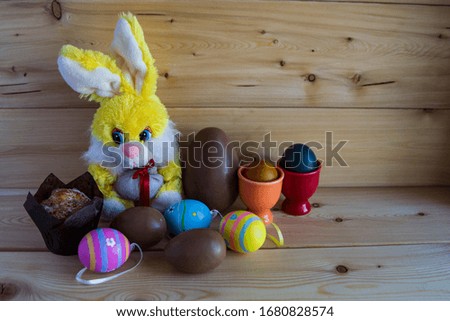 Easter toy hare, decorated and chocolate eggs, no one
