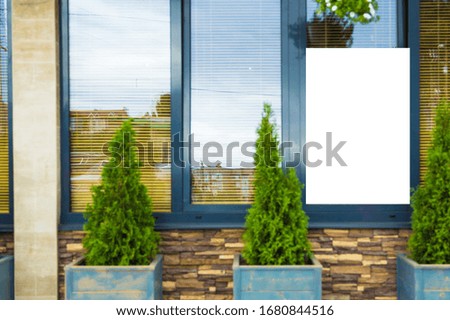 Mockup billboards or blank promotion poster on the window of the restaurant