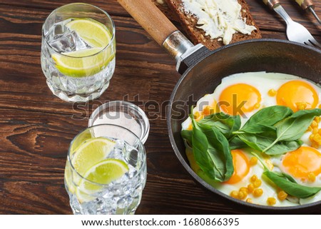 Fried eggs for breakfast close-up. Wooden table. Healthy eating
