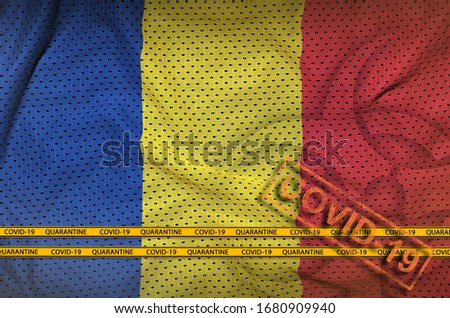 Romania flag and orange Covid-19 stamp with border tape. Coronavirus or 2019-nCov virus concept