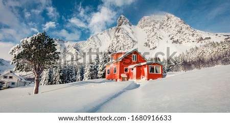 Panoramic winter view of Vestvagoy island, Norway, Europe. Majestic morning scene of Lofoten Islands with typical norwegian wooden red hous. Traveling concept background.  Life over polar circle. 