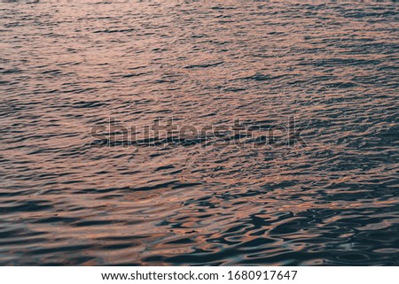 picture of the surface water in the sunset time.