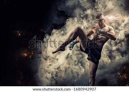Portrait of a boxer of mixed martial arts, who hits with a knee. The concept of sports, mma, kickboxing. Mixed media Royalty-Free Stock Photo #1680942907