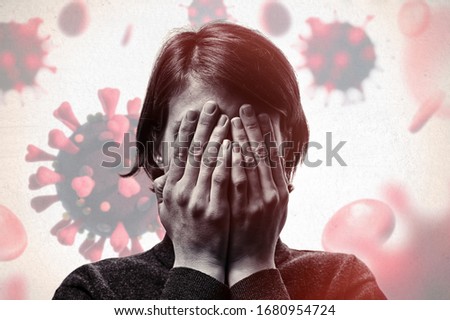 Concept of fear of coronavirus. Woman covers her face her hands on background with coronavirus. Royalty-Free Stock Photo #1680954724