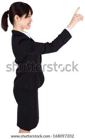 Happy businesswoman pointing
