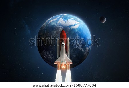 Space shuttle rocket in outer space. Earth and Moon on background. Exploration of the cosmos. Elements of this image furnished by NASA