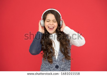 Life is song, sing it. Happy child sing song red background. Little girl listen to song in headphones. Modern life. New technology. Music and song. Fun and entertainment. Royalty-Free Stock Photo #1681015558