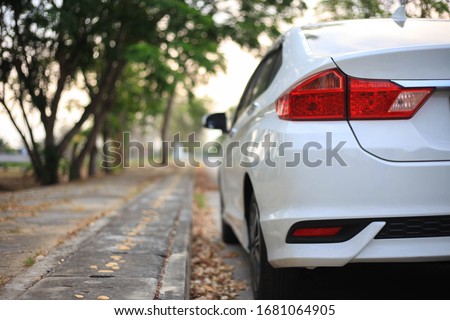 white car on parking,Close up side of white car on the road Royalty-Free Stock Photo #1681064905