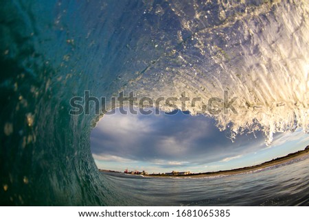 Photographer taken from inside a wave