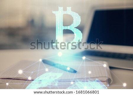 Double exposure of blockchain theme drawings and desk with open notebook background. Concept of Crypto currency