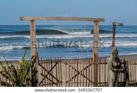 Surfing wave beach photography with wooden gate
