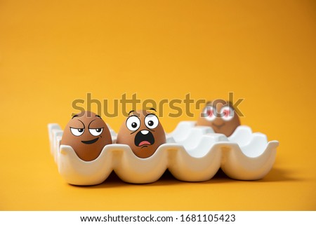 Eggs with various facial expressions On a yellow background