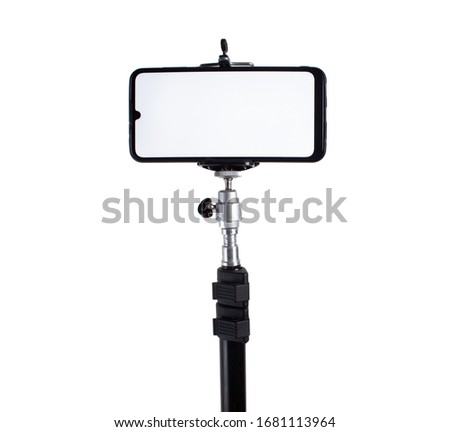 Smartphone mounted on a tripod in a horizontal position on a white isolated background.