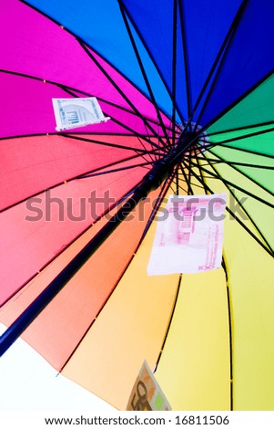 colorful umbrella -  financial shelter (studio shot)