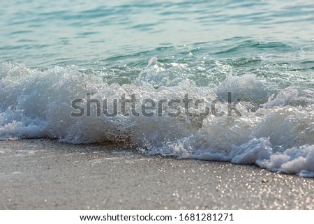 Sea tide splashes, turbulent water closeup. Surface of the sea waves, splash, foam and bubbles at high tide and surf, aqua abstract background