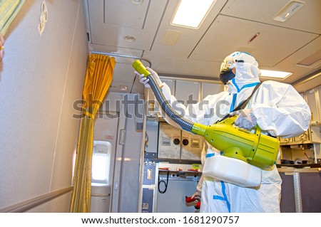 Covid-19 disease virus prevention. Airlines interior cabin deep cleaning for coronavirus. Royalty-Free Stock Photo #1681290757