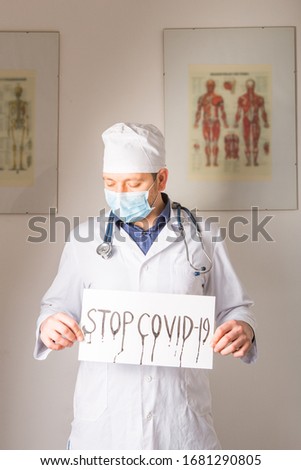 Doctor holding stop sign  Stop COVID-19 conceptual image.