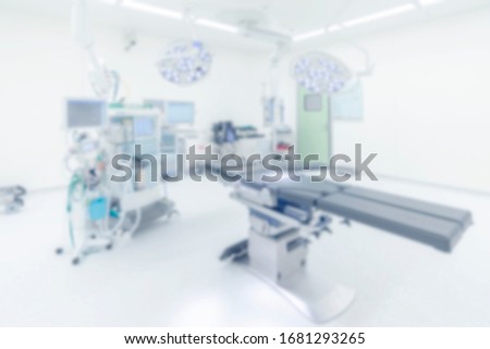 Blurred photo for background of modern operating room. Bright and high key photo. Doctor working in hospital. Orthopaedic operating theatre . Surgery was perform in clean and sterile area. Royalty-Free Stock Photo #1681293265