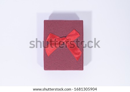 Dark red gift box In the white background