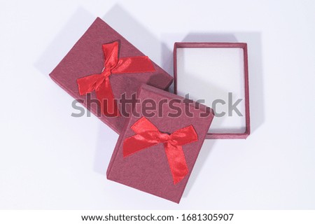 Dark red gift box In the white background